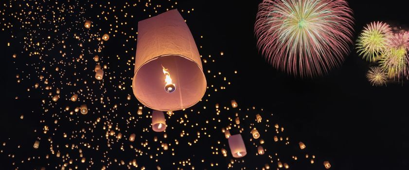 Tourist floating sky lanterns in Loy Krathong festival , Chiang Mai ,Thailand.