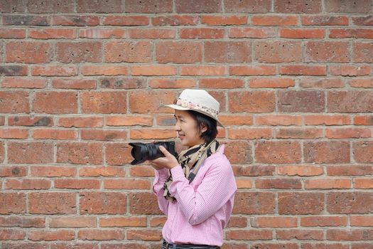 Traveler Tourist Woman Hold Photo Camera in China