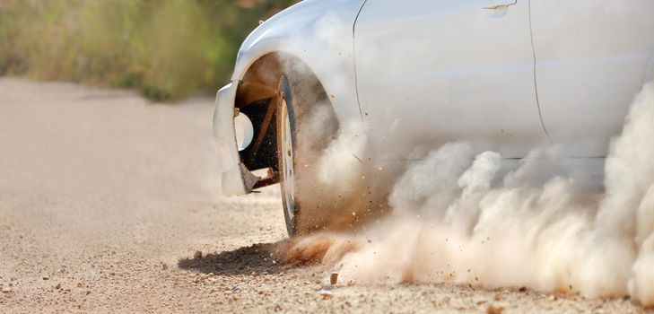 Rally racing car in dirt track.