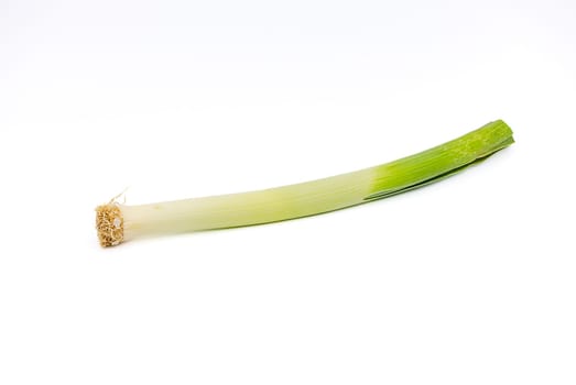 A stalk of leeks or leeks isolated against a white background as a studio shot