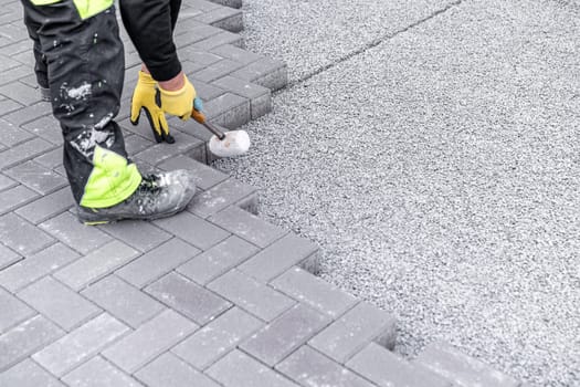 construction of a sidewalk from concrete blocks.