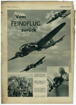 HAMBURG, GERMANY - 1939: Reproduction of magazine page shows pictures from Nazi Germany. Pilots and airplanes of Luftwaffe.