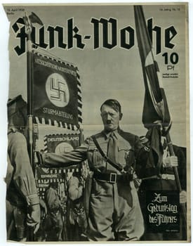 BERLIN, GERMANY - APRIL 16, 1939: Reproduction of magazine page shows Adolf Hitler.