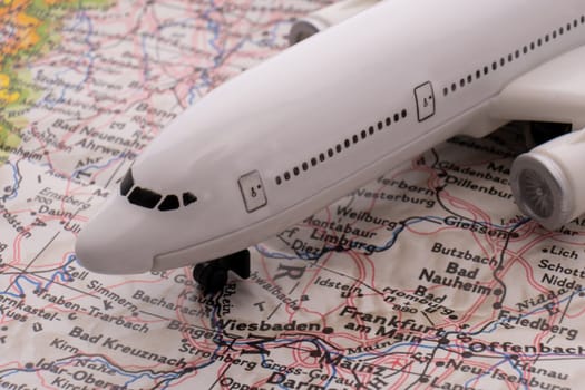 Close up of a colorful map focusing on Frankfurt, Germany through selective focus, background blur.