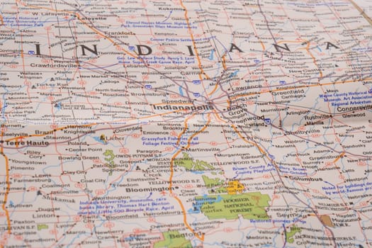 Close up detail of a colorful road map focusing on Indianapolis Indiana through selective focus, background blur