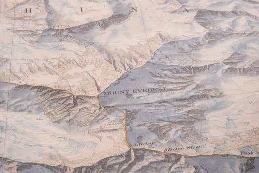 Selective focus close up of map detail of Mt. Everest topographical map showing contour lines, elevation. High quality photo