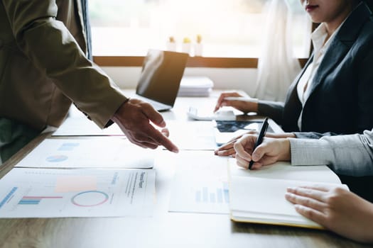 Asian entrepreneurs and business people meeting in a conference room in business planning, financial budget and investment risk assessment to analyze customer groups to increase company growth.