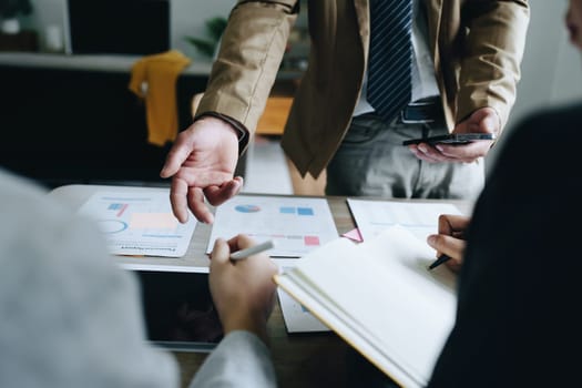 Asian entrepreneurs and business people meeting in a conference room in business planning, financial budget and investment risk assessment to analyze customer groups to increase company growth.