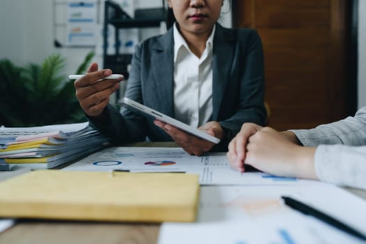 Asian entrepreneurs and business people meeting in a conference room in business planning, financial budget and investment risk assessment to analyze customer groups to increase company growth.