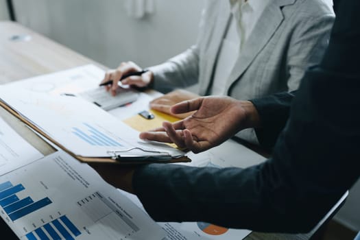 Asian entrepreneurs and business people meeting in a conference room in business planning, financial budget and investment risk assessment to analyze customer groups to increase company growth.