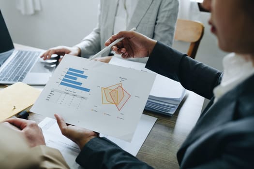 Asian entrepreneurs and business people meeting in a conference room in business planning, financial budget and investment risk assessment to analyze customer groups to increase company growth.