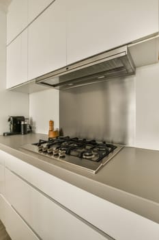 a kitchen with white cabinets and stainless appliances on the counters in this photo is taken from the front view