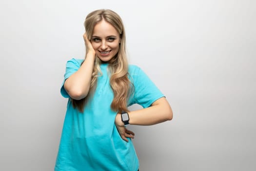 cheerful girl getting high on white studio background.