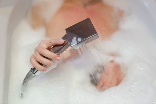 running water shower with hand.