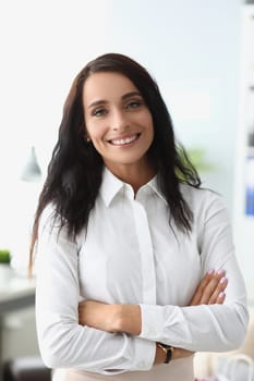 Portrait of smiling beautiful woman in white shirt. Business consultant manager and bank employee