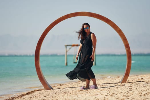 Adult european womanman have vacation and enjoying free time on the beach of sea.