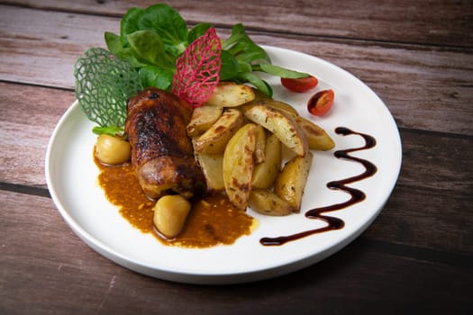 Recipe for boneless rolled chicken leg with potatoes and molasses-flavoured mache salad, High quality photo