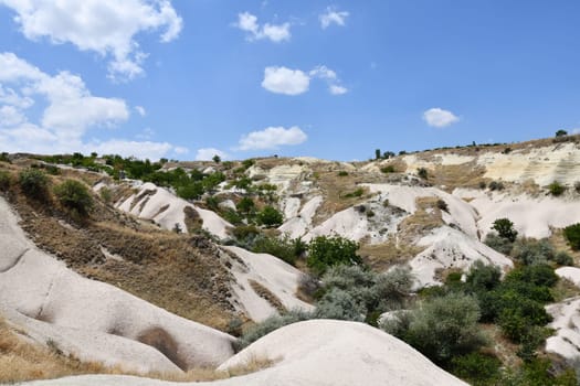 Rocky sandstone formations near Love Valley in Goreme National Park, Nevsehir, Cappadocia, Turkey