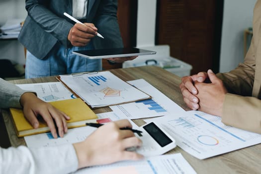 Asian entrepreneurs and business people meeting in a conference room in business planning, financial budget and investment risk assessment to analyze customer groups to increase company growth.