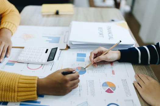 Asian entrepreneurs and business people meeting in a conference room in business planning, financial budget and investment risk assessment to analyze customer groups to increase company growth.