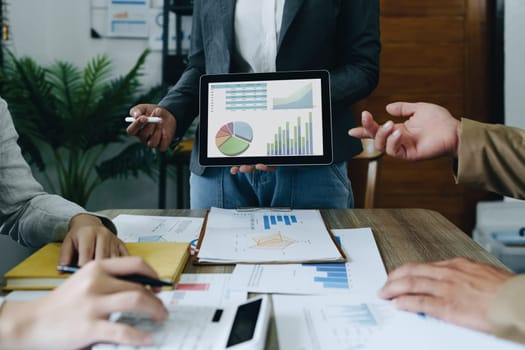 Asian entrepreneurs and business people meeting in a conference room in business planning, financial budget and investment risk assessment to analyze customer groups to increase company growth.