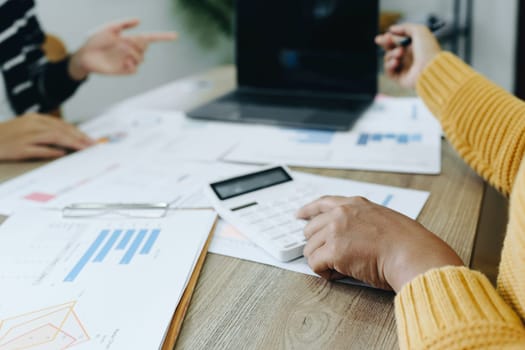 Asian entrepreneurs and business people meeting in a conference room in business planning, financial budget and investment risk assessment to analyze customer groups to increase company growth.