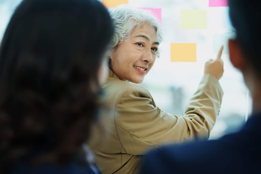 Asian entrepreneurs and business people meeting in a conference room in business planning, financial budget and investment risk assessment to analyze customer groups to increase company growth.