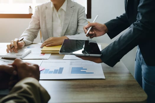 Asian entrepreneurs and business people meeting in a conference room in business planning, financial budget and investment risk assessment to analyze customer groups to increase company growth.