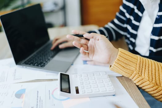 Asian entrepreneurs and business people meeting in a conference room in business planning, financial budget and investment risk assessment to analyze customer groups to increase company growth.