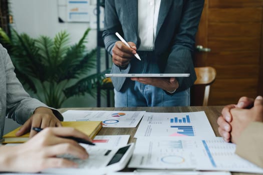 Asian entrepreneurs and business people meeting in a conference room in business planning, financial budget and investment risk assessment to analyze customer groups to increase company growth.