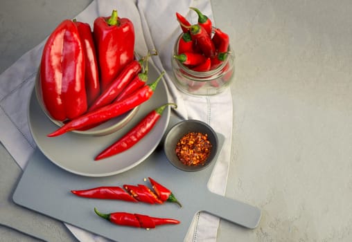 Grey background with chili pepper. Red, hot. Capsicum. Seasoning Spice Mexican