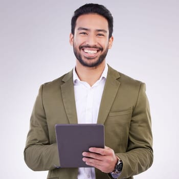 Business man, tablet and smile portrait in studio for internet, communication and network connection. Entrepreneur male online for mobile app networking, marketing or research on investment or sales.
