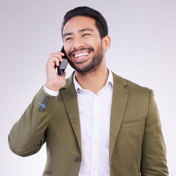 Business man, smile and phone call in studio for communication and networking on gray background. Asian male entrepreneur with smartphone for conversation or talking to contact for happy negotiation.