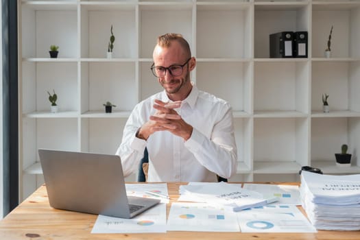 Business man sitting in of her considering work, office work Business man sitting thinking work concept.