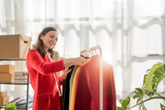 young woman work for checking the clothes in the home, concept e commerce...