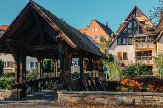 Old national German town house. Old Town is full of colorful and well preserved buildings. Baden-Wurttemberg is a state in southwest Germany bordering France and Switzerland. The Black Forest, known for its evergreen scenery and traditional villages, lies in the mountainous southwest. Stuttgart, the capital, is home to Wilhelma, a royal estate turned zoo and gardens. Porsche and Mercedes-Benz have headquarters and museums there. The 19th-century Hohenzollern Castle sits in the Swabian Alps to the south.