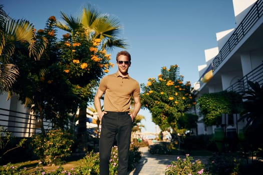 Beautiful nature. Young man is outdoors at sunny daytime. Concept of vacation.
