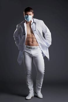 Young dancer in white doctor costume. Studio portrait
