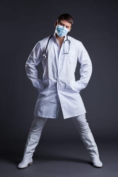 Young sexy striptease dancer in doctor costume. Studio portrait