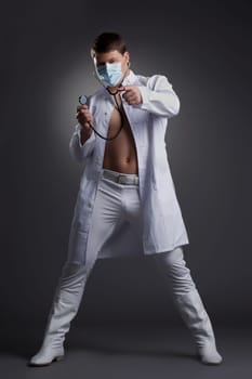 Young dancer in doctor costume. Studio portrait