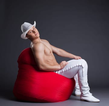 Full length portrait of sexy cowboy in studio