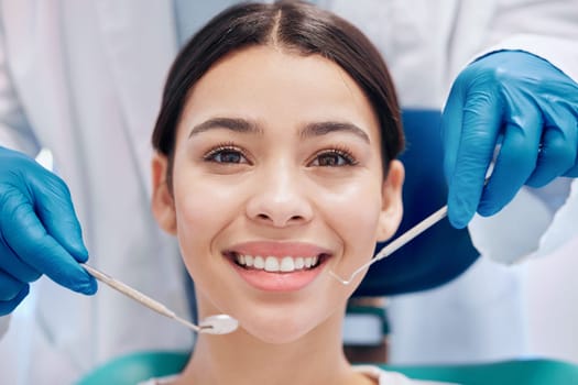 Shes ready for the full service. a young woman looking happy in her dentists office