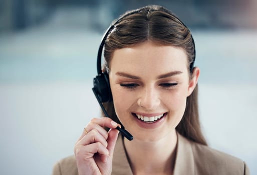 Following various communication scripts when addressing caller inquiries. a young call centre agent working in an office