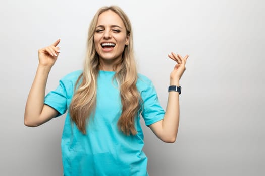 cheerful girl getting high on white studio background.