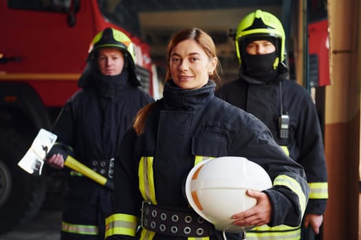 Group of firefighters in protective uniform that is on station.