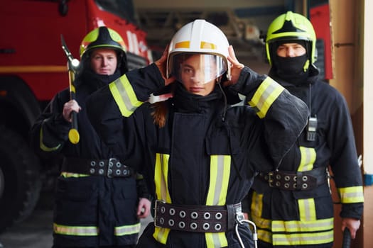 Group of firefighters in protective uniform that is on station.