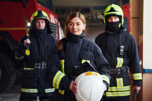 Group of firefighters in protective uniform that is on station.