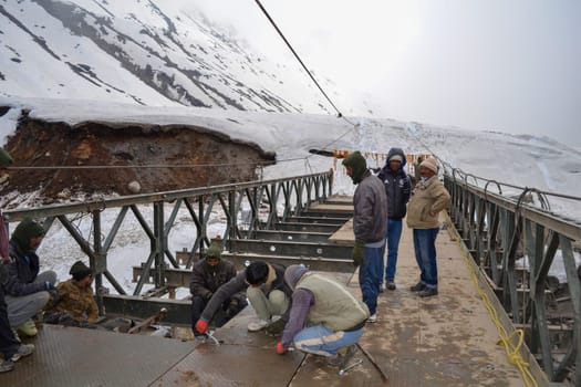 Rudarprayag, Uttarakhand, India, May 18 2014, Kedarnath reconstruction project, rebuilding bridges damaged in disaster. Kedarnath was devastated on June 2013 due to landslides and flash floods that killed more than 5000 people in Uttarakhand.