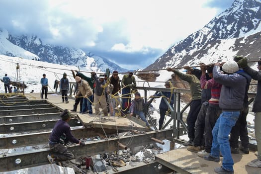 Rudarprayag, Uttarakhand, India, May 18 2014, Kedarnath reconstruction, rebuilding bridge damaged in disaster. Kedarnath was devastated on June 2013 due to landslides and flash floods that killed more than 5000 people in Uttarakhand.