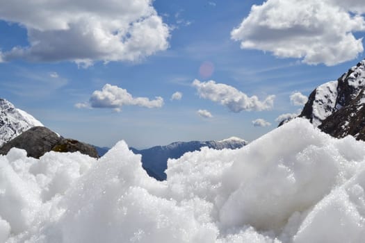 Snow like cotton in Himalaya Uttarakhand India. The Himalayas, or Himalaya is a mountain range in Asia separating the plains of the Indian subcontinent from the Tibetan Plateau. T